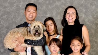 Principal's family photo with pet dog